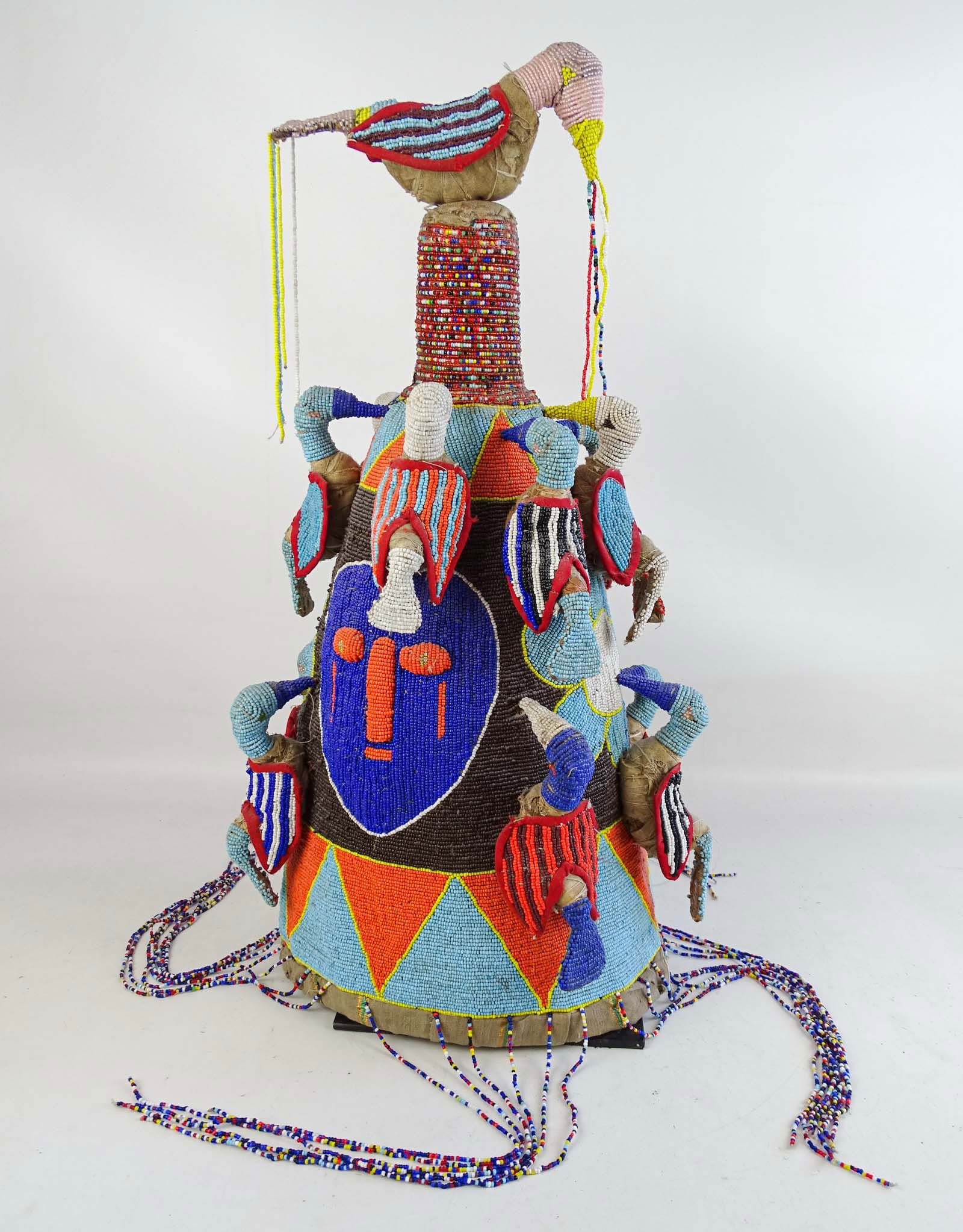 African Beaded Headress: African beaded headress. Custom stand. 24" Ht..