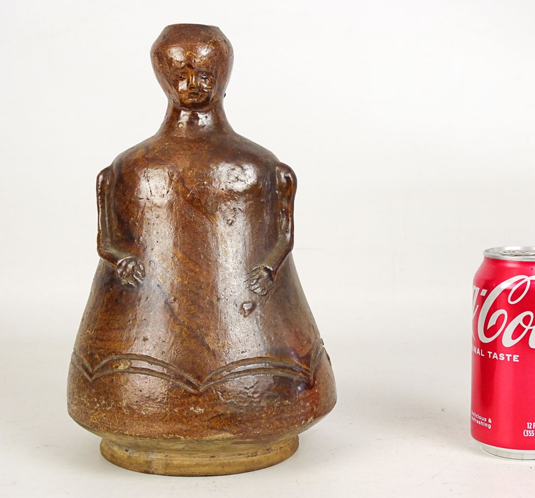 Stoneware Aquamanile: Stoneware Aquamanile in the form of a gourd with a human head. 10 1/2" Ht.