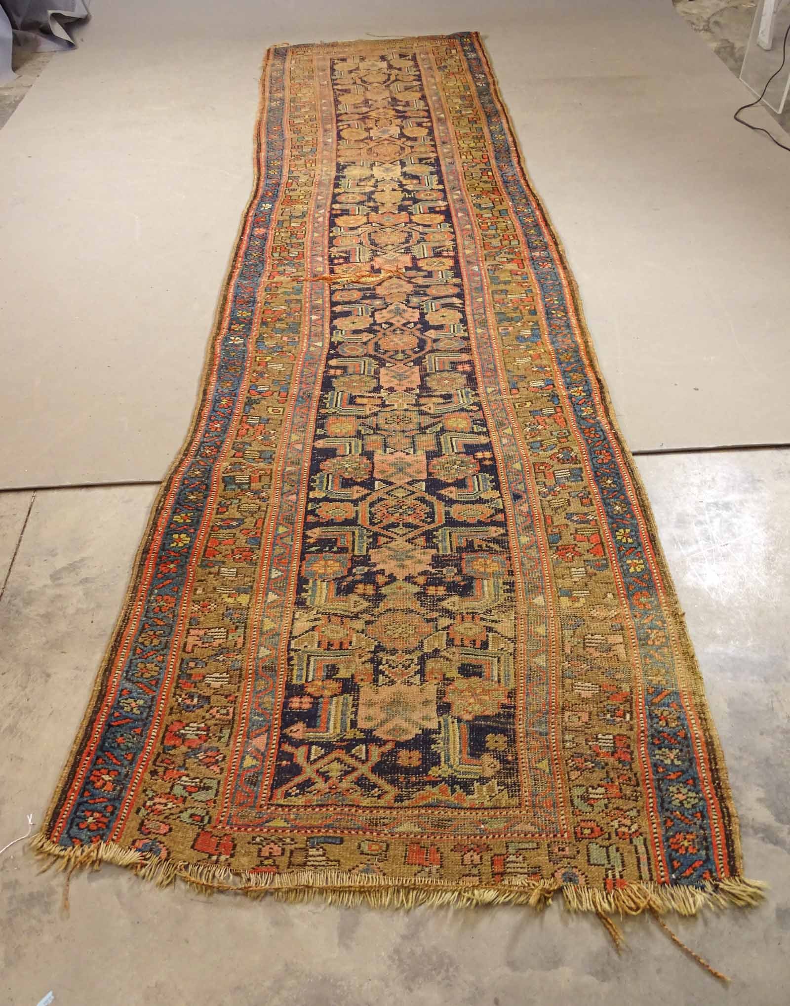 Oriental Rug Runner: Oriental rug runner. Some damage. 38" x 138".
