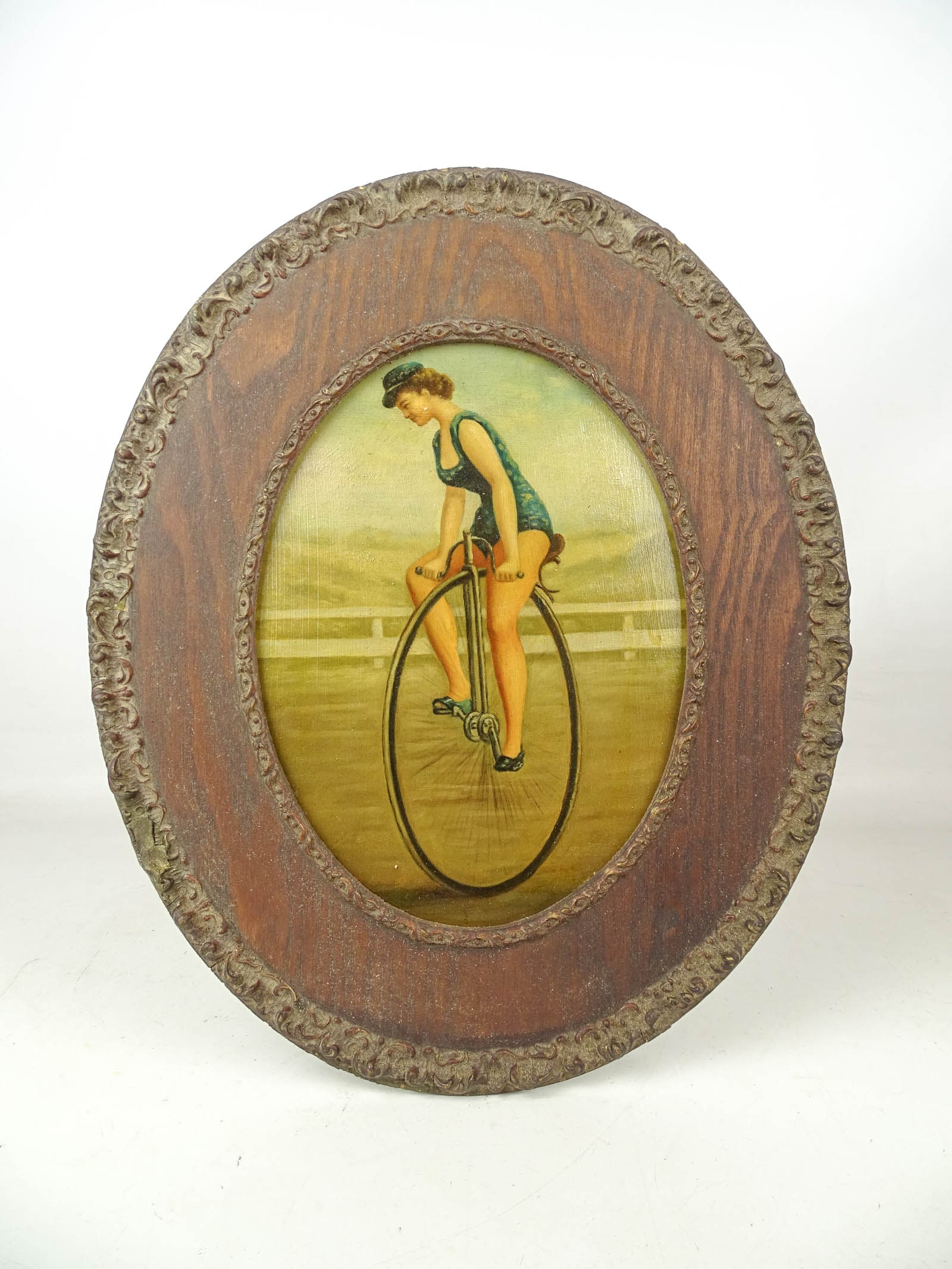 Painting: Women on a High Wheel Bicycle: Painting: Woman on a high wheel bicycle. Oil on panel. Overall in frame 18" x 15". Note it’s a high wheel Unicycle.