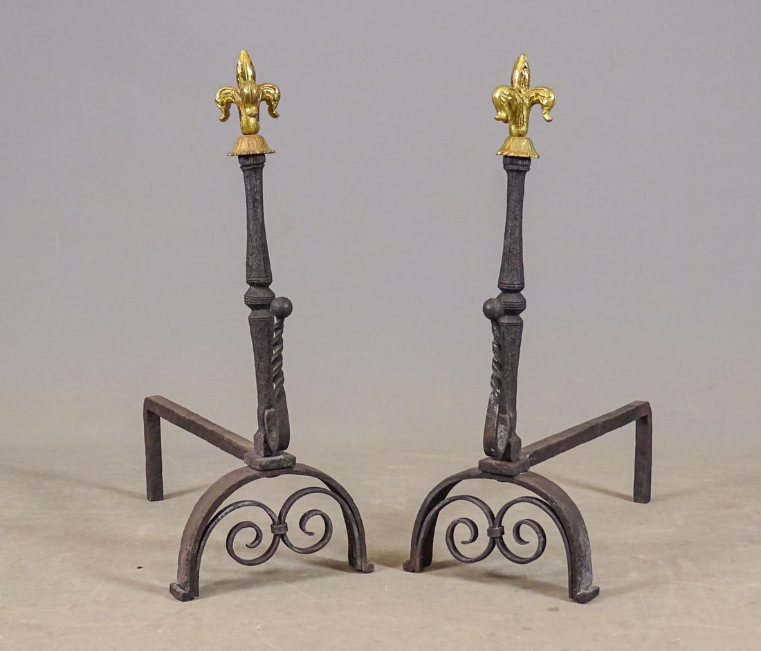 Pair French Andirons: Pair of French andirons with Fleur De Lis finials. 24 1/2" Ht., 19" D..