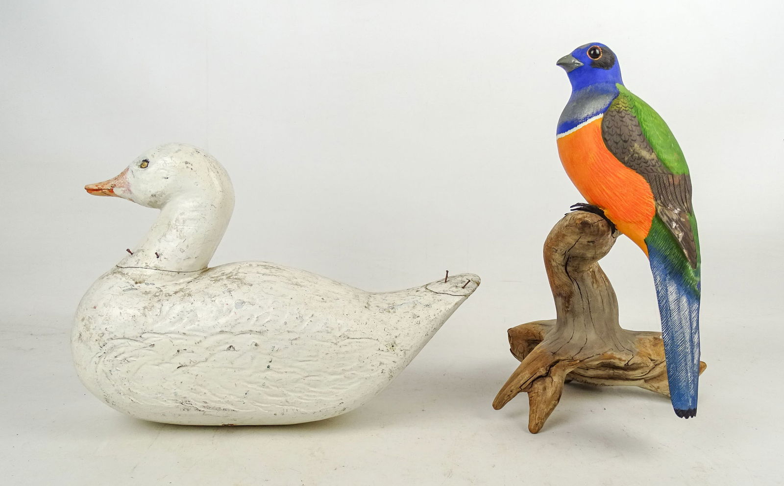Folk Art Carved Birds: Lot including folk art carved wooden decoy (12" L., as is, nails sticking out), and bird on driftwood base (12" Ht.).
