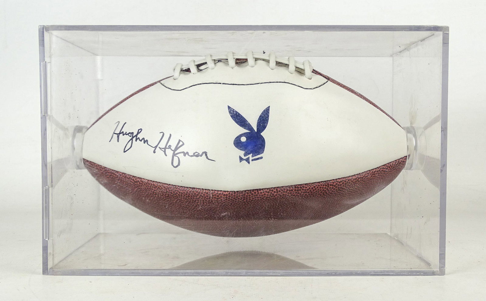 Hugh Heffner Autographed Football: Hugh Heffner autographed Playboy football. Comes with custom case (overall 12" x 7 1/2" x 7 1/2").