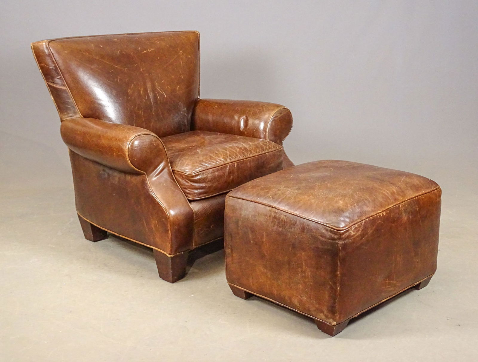 Leather Wing Chair and Ottoman: Leather wing chair and ottoman. Chair 36" x 29" x 35" Ht..