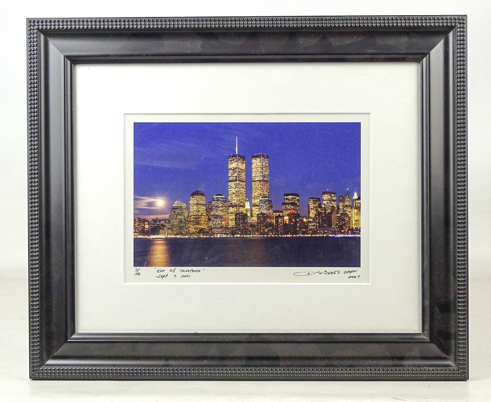 New York City Photograph: New York City photograph of Twin Towers. Marked "ve of Innocence" (Sept. 7, 2001). Overall in frame 14" x 17". Artist Michael Chen.