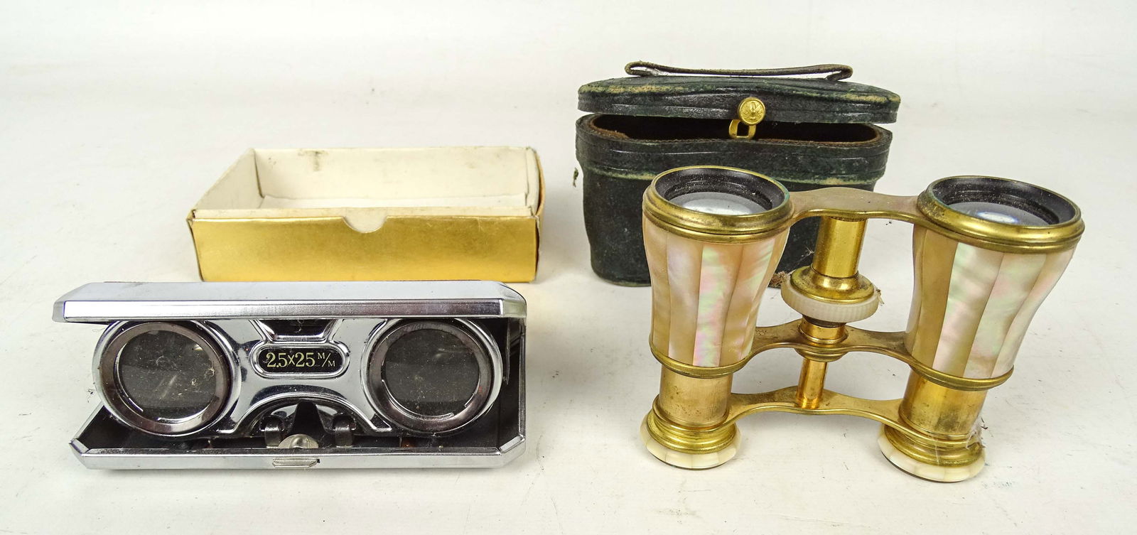 Opera Glasses: Two pair of early/vintage Opera glasses. One pair signed Paris.