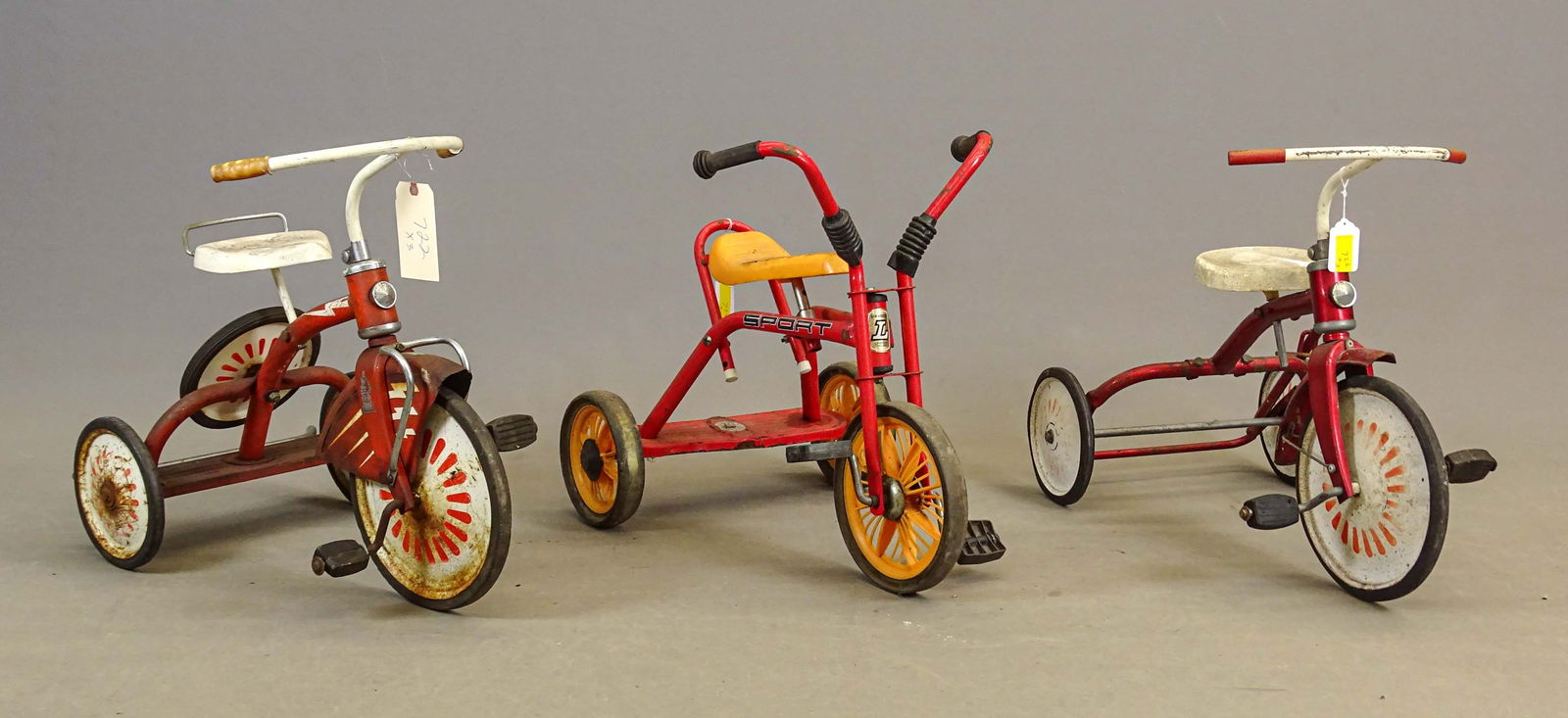 Child's Tricycle Lot: Child's tricycle lot including: Raleigh disc wheel with Continental spare, skirted fender, rear bumper (27" L.), Lew Ways LTD "Sport" plastic disc wheels (18" x 25" L.), red and white disc wheels (16"