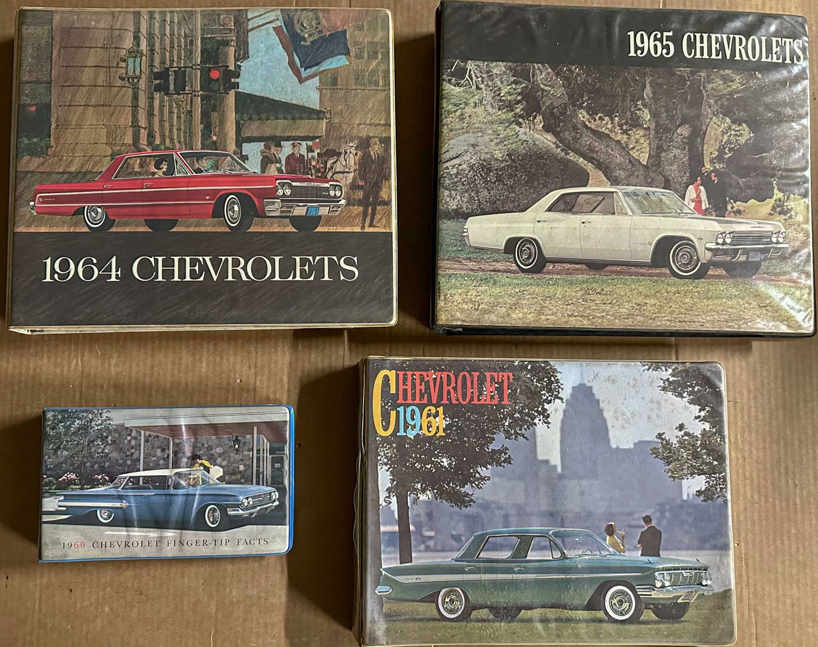 Four Chevrolet Dealer Albums: Four Chevrolet dealer albums - 1960 small Finger Tip Facts, 1961, 1964, 1965.