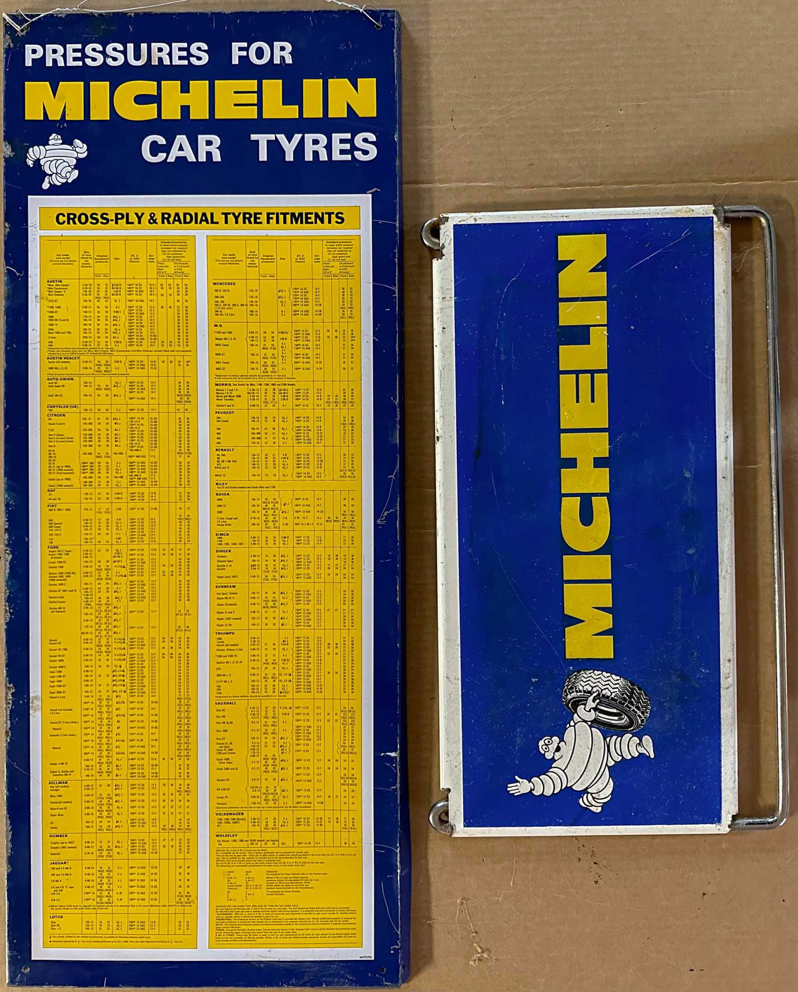Michelin Lot: Two Michelin items - tin tire spec sign for 1960's European cars, 30 x 12 and heavy tire stand, 19 x 10. Meltz Collection, Columbia County New York.