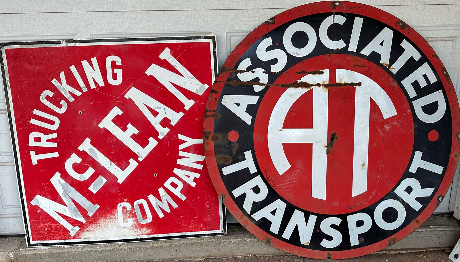 Trucking Company Signs: Two trucking company signs - Associated Transport, painted tin, 48 dia, McLean painted tin, 38 square. Meltz Collection, Columbia County New York.