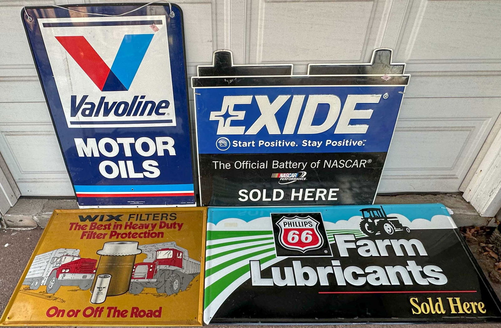 Four auto Misc. Lot: Four auto parts related signs - painted on tin, various ages, approx 30 x 36 each. Meltz Collection, Columbia County New York.