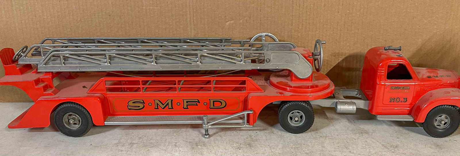 Smith Miller Truck: Ca 1950's Smith Miller hook and ladder fire engine, appears to be original paint, 38 inches overall length. Meltz Collection, Columbia County New York.