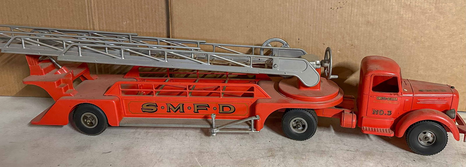 Smith Miller Truck: Ca 1950's Smith Miller hook and ladder fire engine, appears to be original paint, 38 inches overall length. Meltz Collection, Columbia County New York.