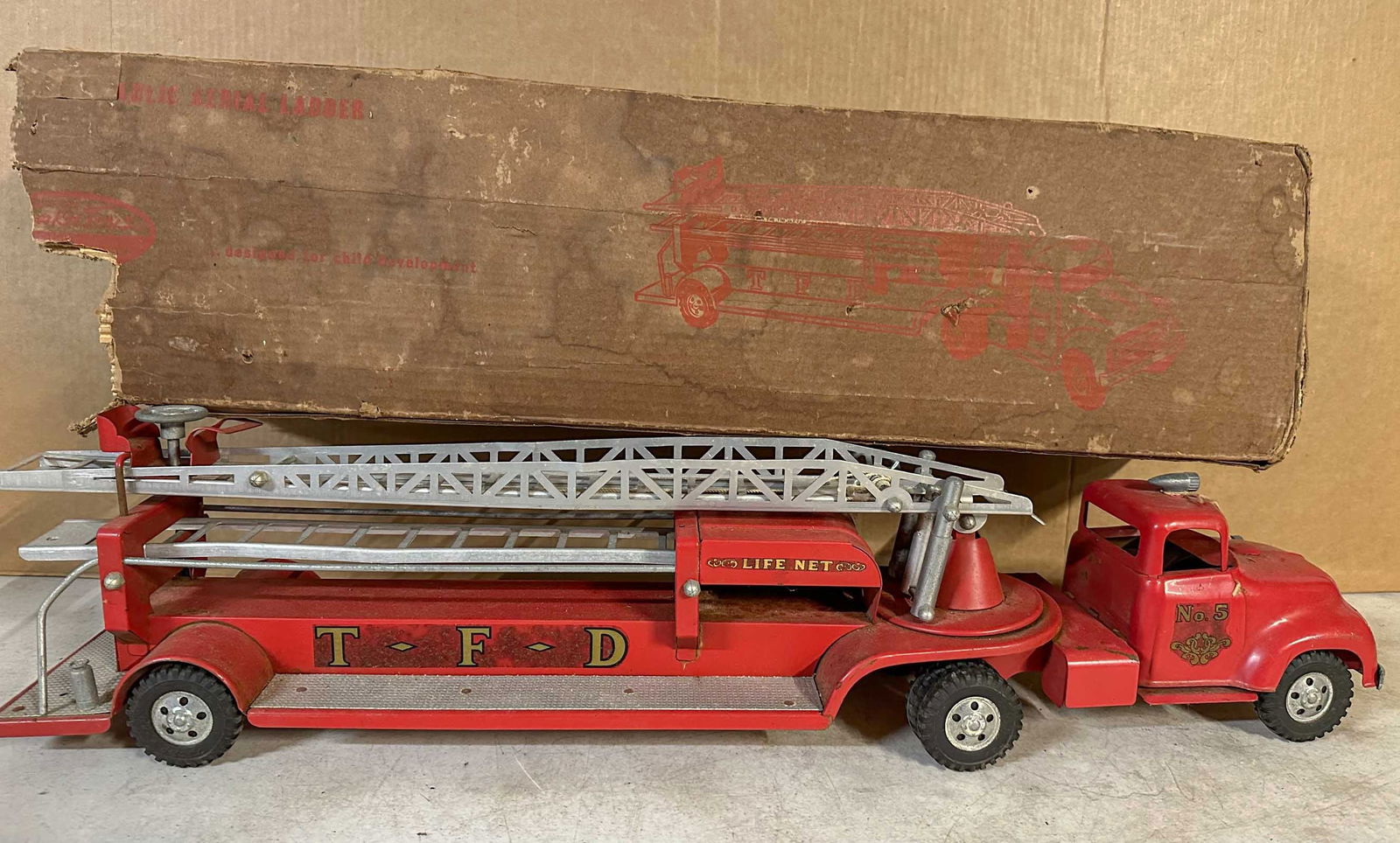 Tonka Truck: Ca 1950's Tonka No 5 T F D fire truck, with original box, original paint and decals, 32 long. Meltz Collection, Columbia County New York.