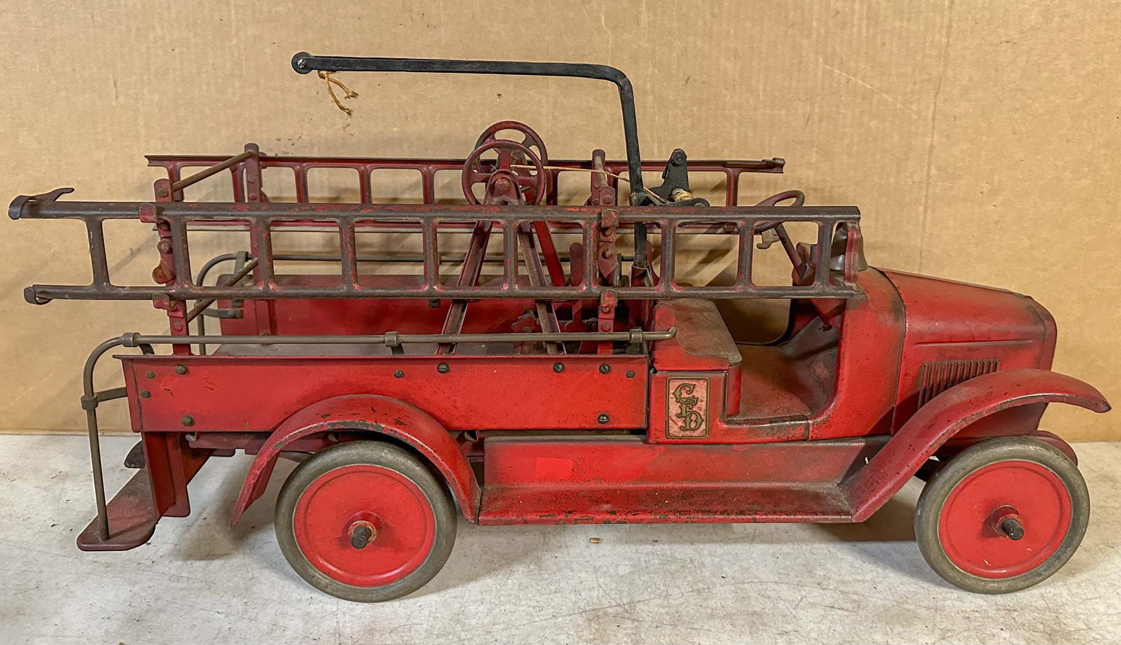 Buddy L Truck: Ca 1927 Buddy L fire truck, with wrecking crane, original paint and decals, 26 overall length. Meltz Collection, Columbia County New York.