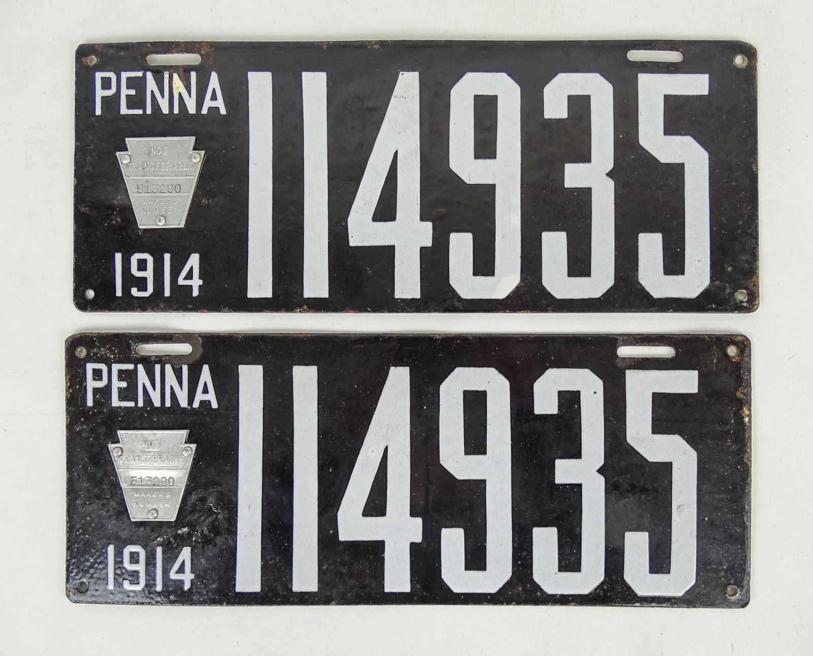 Auto License Plates, 1914: Pair of 1914 porcelain auto license plates, "Penna 114935". 6" x 15".