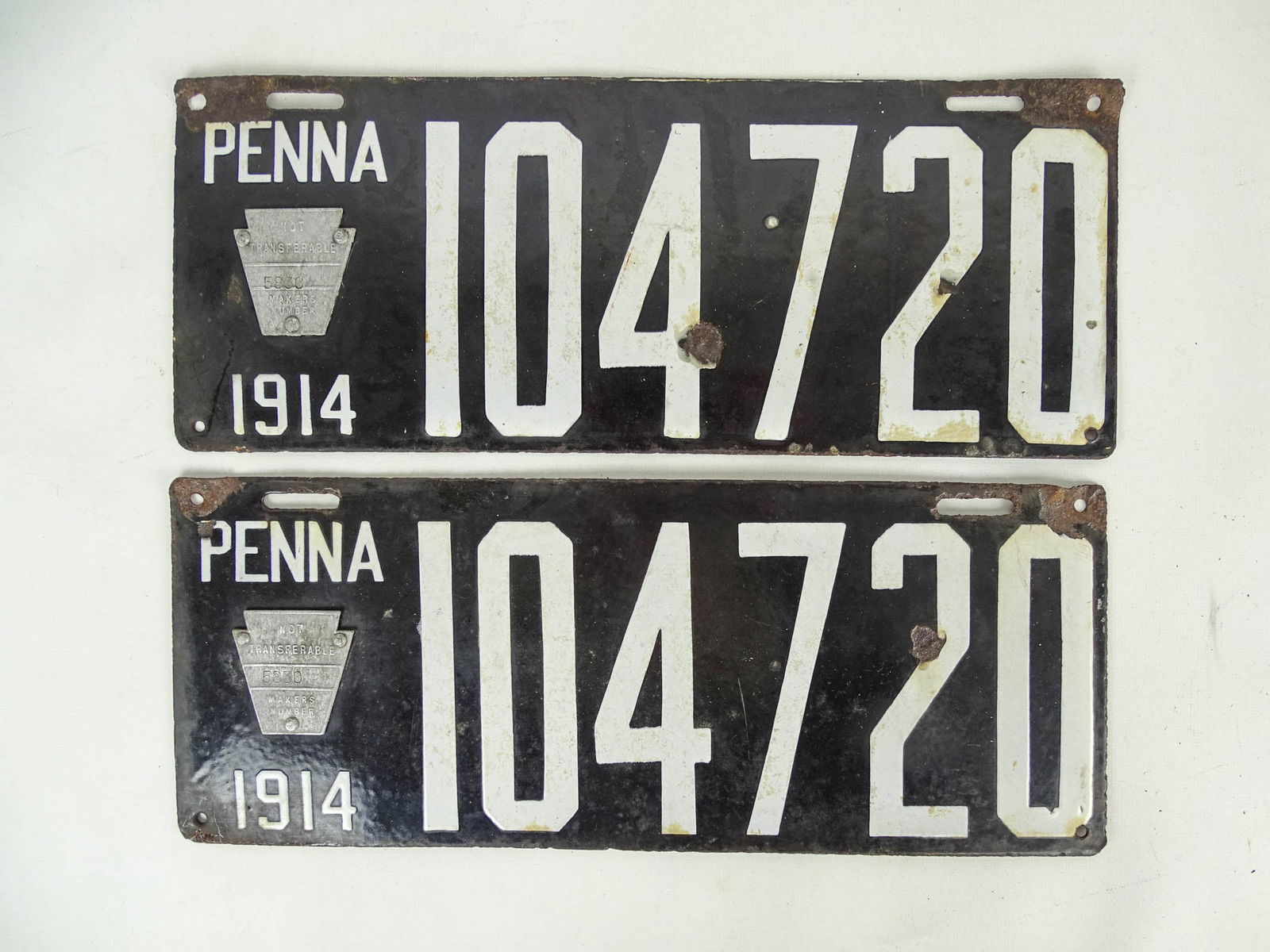 Auto License Plates, 1914: Pair of 1914 porcelain auto license plates, "Penna 104720". 6" x 15".