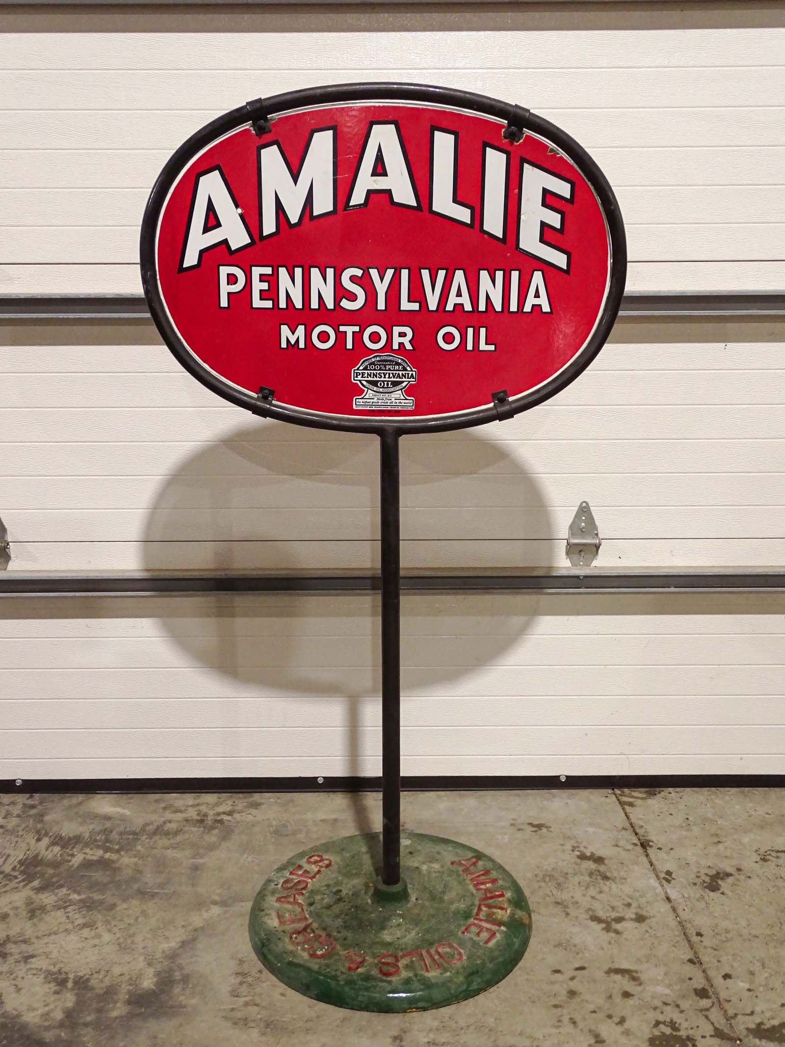 Gas Station Sign: Amalie Penn. Motor Oil gas station sign with cast iron inscribed base.