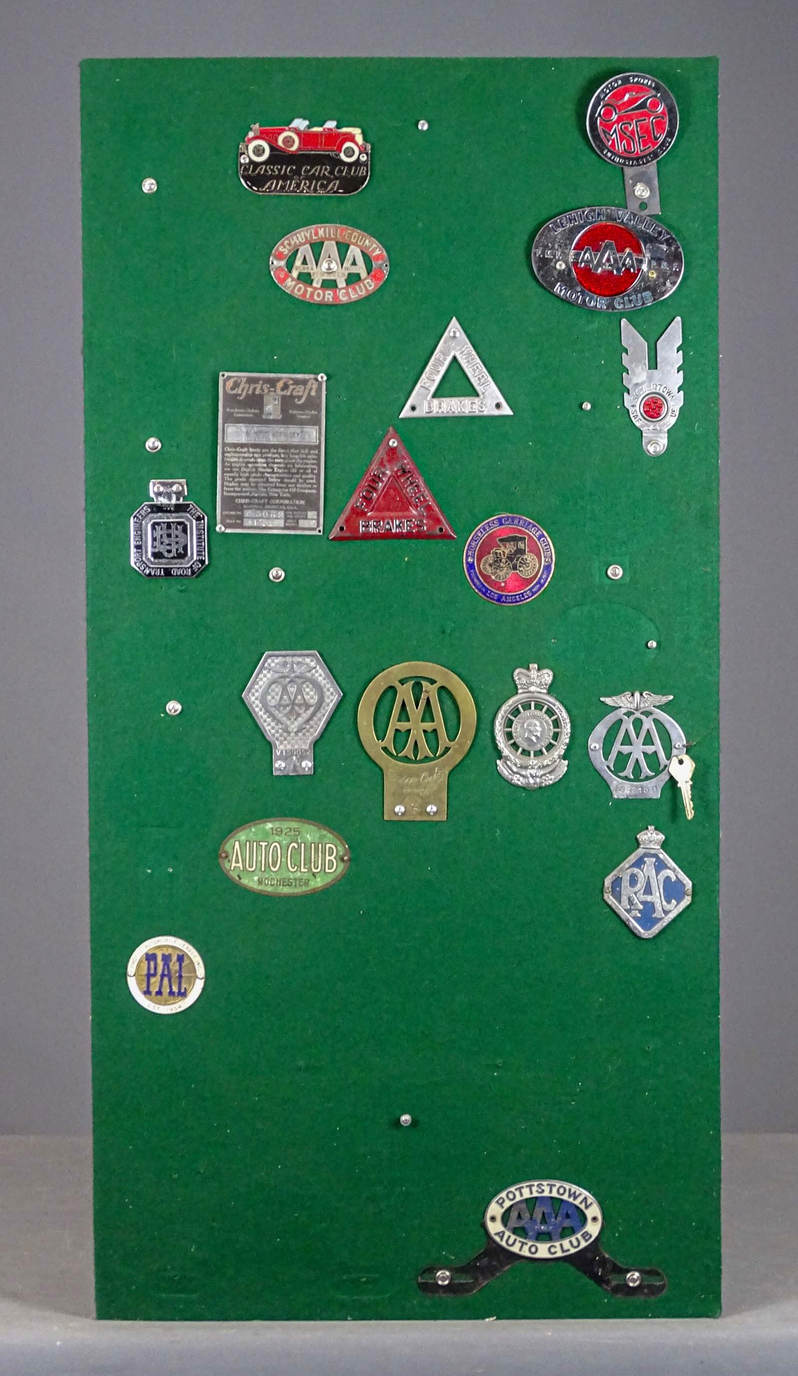 Automobile Badges: Lot of assorted Automobile badges mounted to panel. 48" x 24". Meltz Collection, Columbia County New York.