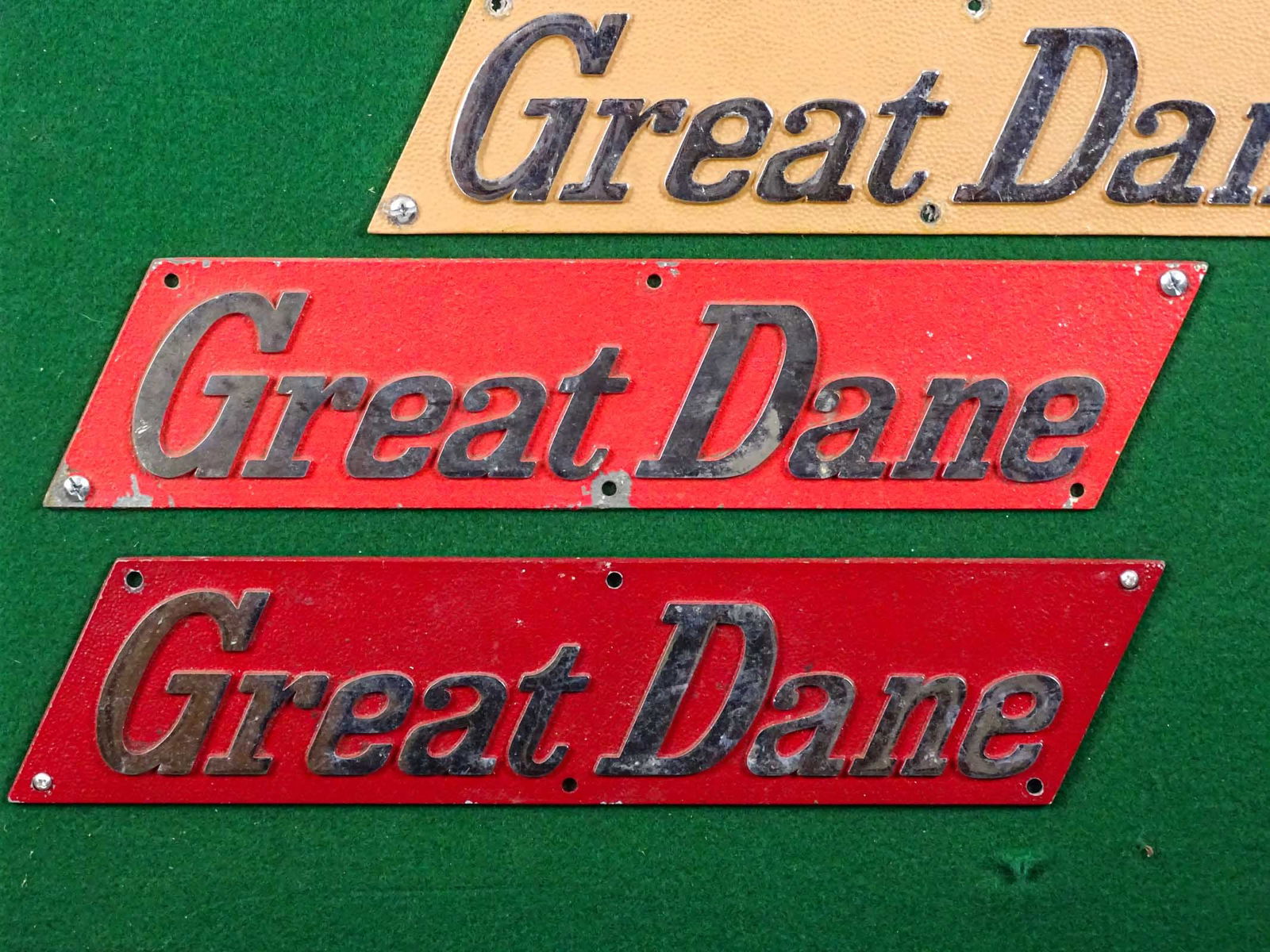 Automobile Badges: Lot of assorted Automobile badges mounted to panel. 48" x 24". Meltz Collection, Columbia County New York.