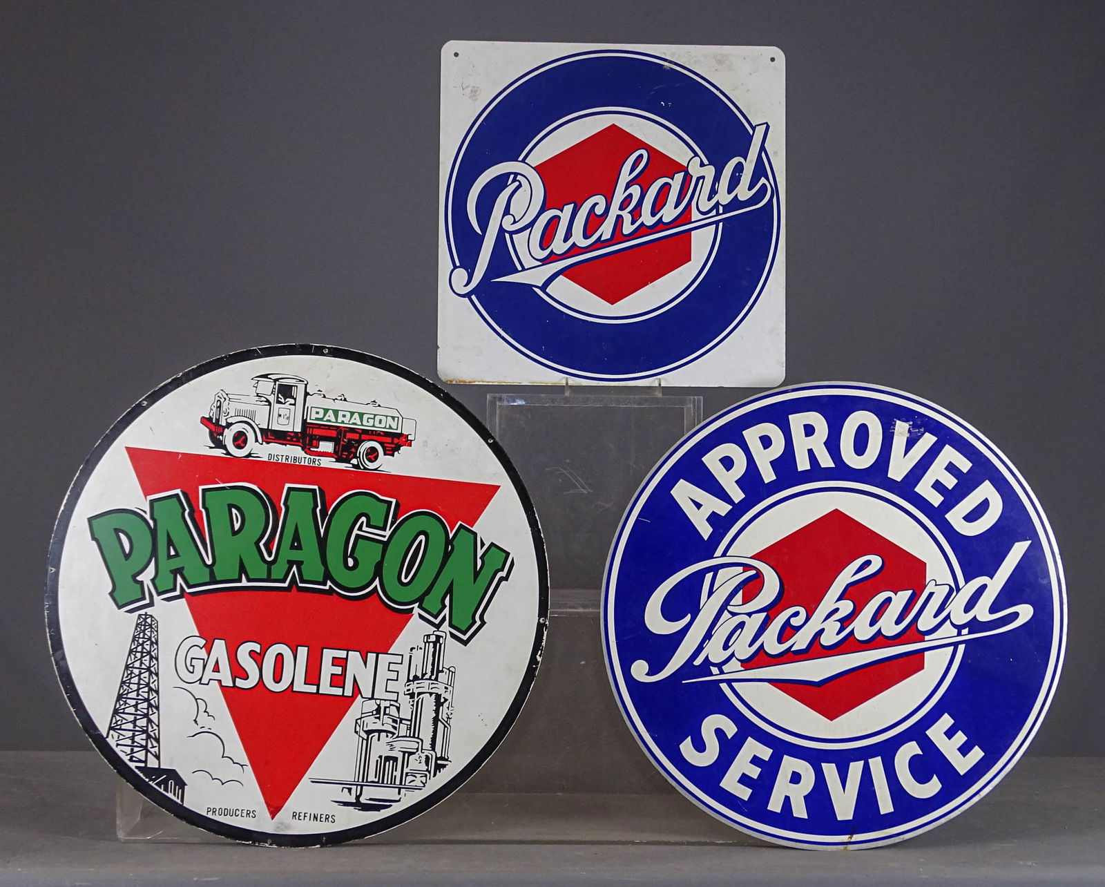 Sign Lot: Misc. sign lot: Paragon (26" D.), (2) Packard (23 1/2" D., 18" x 18"). Meltz Collection, Columbia County New York.