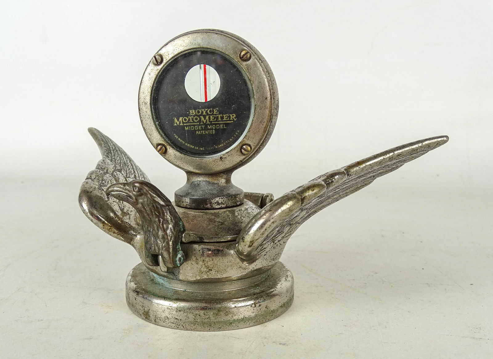 Boyce Moto Meter Mascot: Boyce Moto Meter (midget model), on bird with outstretched wings, radiator mascot. 4" Ht, 7" W.