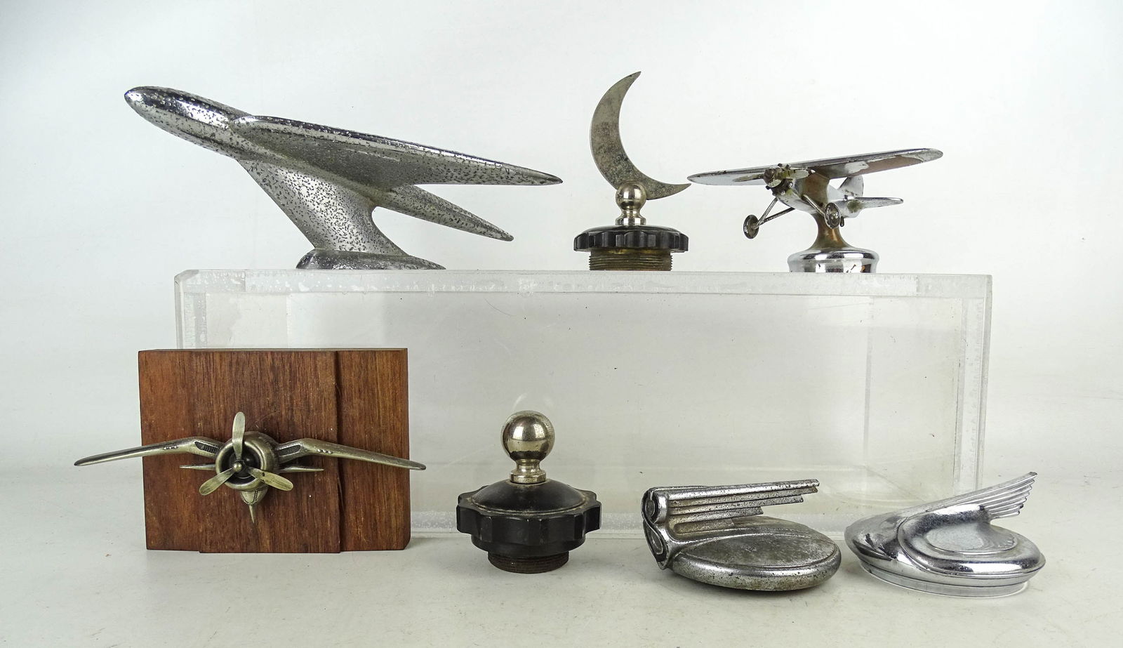 Automobilia Lot: Misc. Lot (7 pieces): 1920s Airplane (2 3/4" Ht, 6 1/2" W), mounted airplane (possibly vintage Bergamont Brass works belt buckle, 7" W), Willy's Aero Eagle hood ornament (C. 1952, 3 3/4" Ht. 10 1/2"