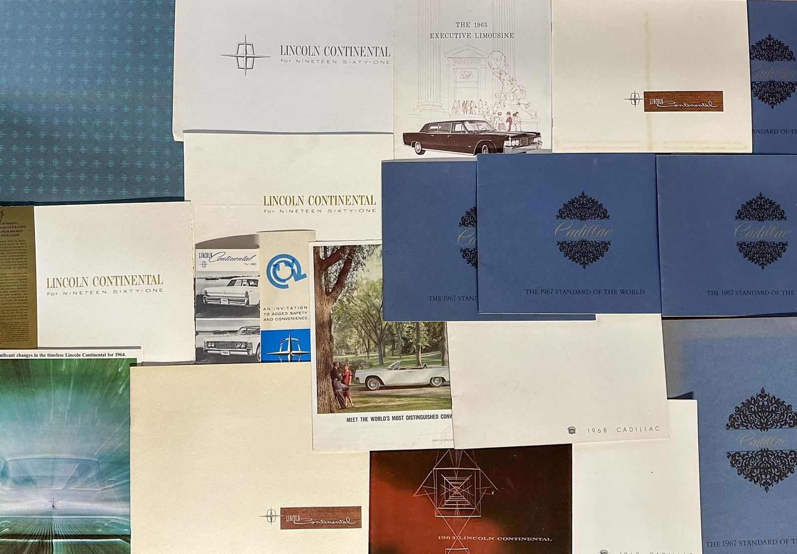 Lincoln Brochures: Thirty seven 1961 - 1966 Lincoln brochures and seventeen 1965 - 1969 Cadillac brochures - fifty four total.