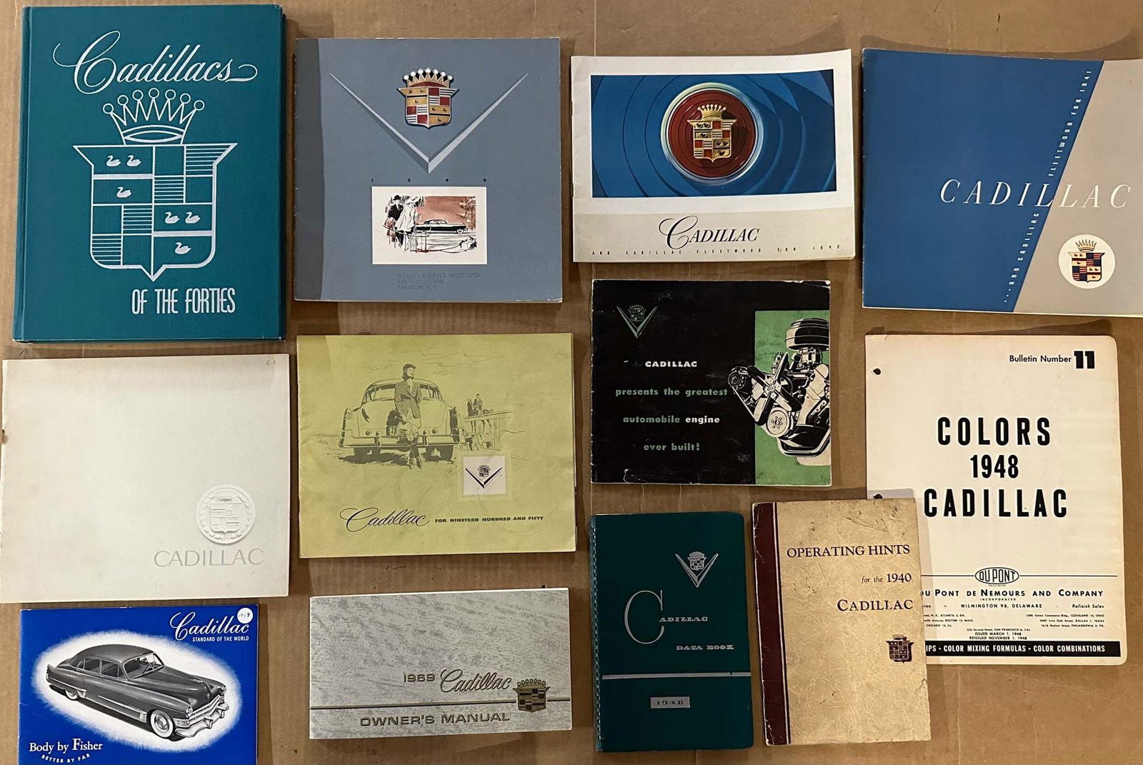 1940's - 1960's Cadillac sales catalogs and manual: Collection of 1940's - 1960's Cadillac sales catalogs and manuals, including 1948 Data Book, 24 items total, vg condition