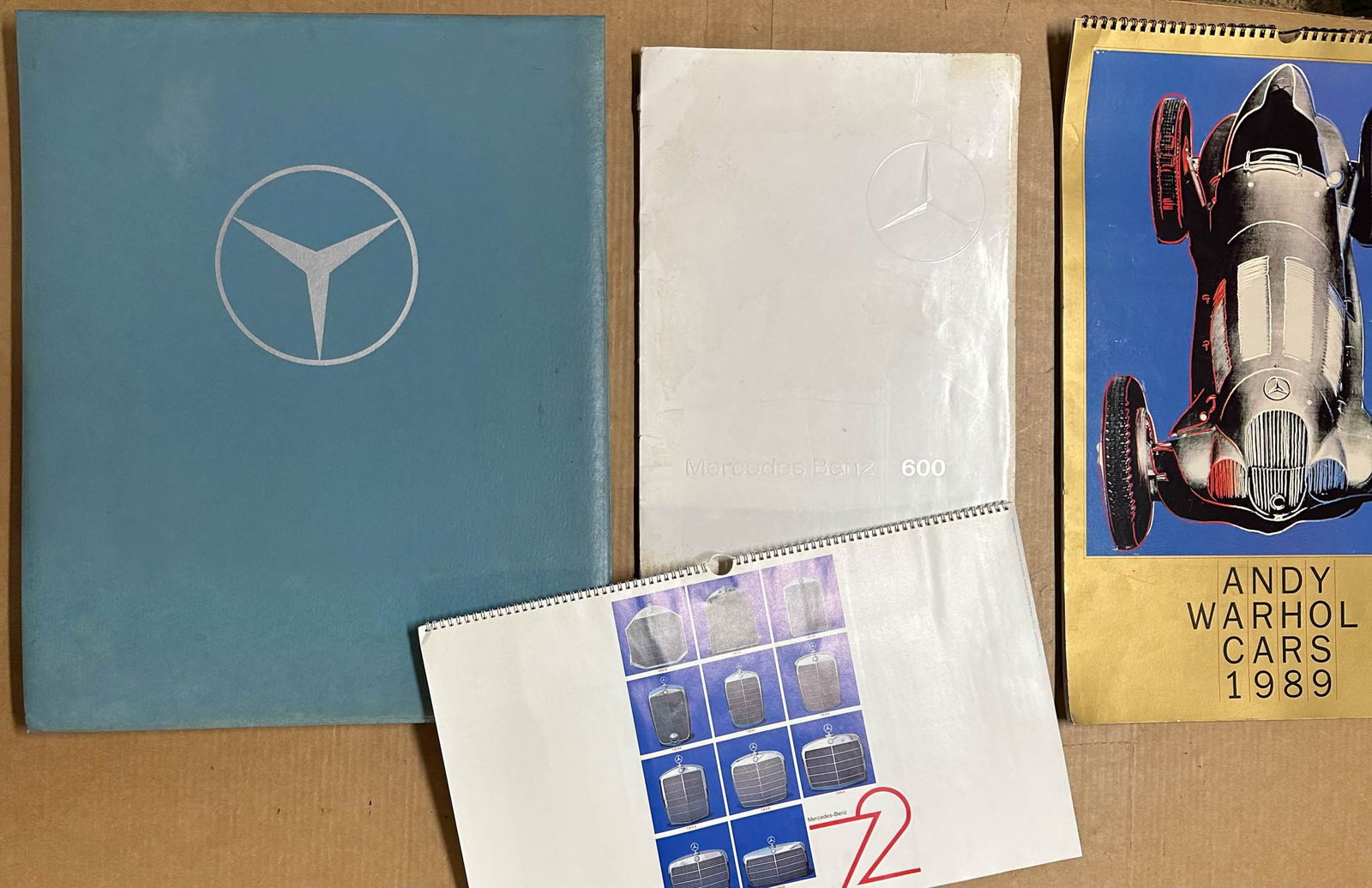 Mercedes Benz items: Mercedes Benz items - mid 1960's dealers lecture display, 21 x 17, 1989 Andy Warhol calendar, 22 x 15, late 1960's Model 600 portfoilo with nine plates, 1972 calendar, vg condtion