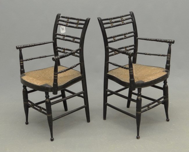 Pair 19th c. Sheraton Chairs: Pair 19th c. bamboo turned rush seat armchairs in old black paint. 18" seat Ht., 35" overall Ht.
