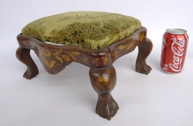 19th c. Footstool: 19th c. inlaid footstool with supressed ball and claw feet. Chips to feet. 13" length 7" Ht.