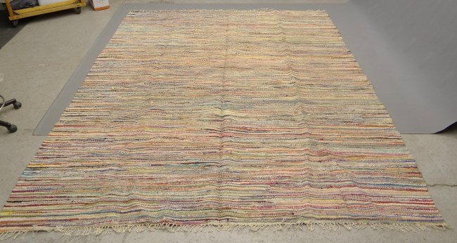 Rag Rug: Round rag rug. 10' x 12'.