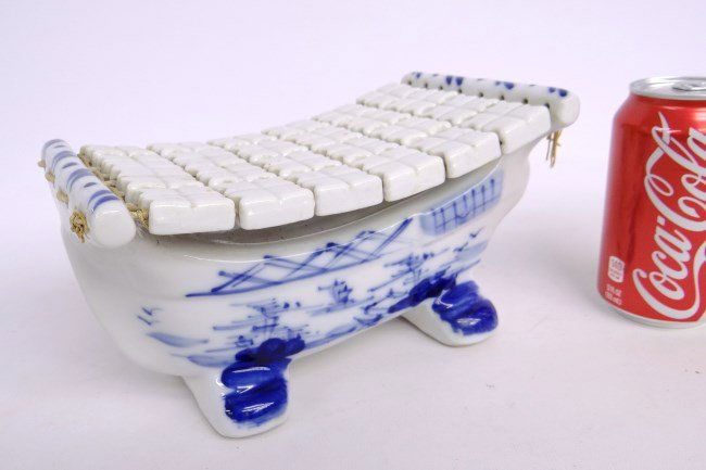 Asian Porcelain Trivet: Asian porcelain trivet. 9" x 5" x 5".