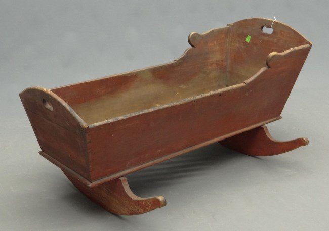 19th c. Cradle: 19th c. cradle in old red paint. 42" length, 21" Ht.