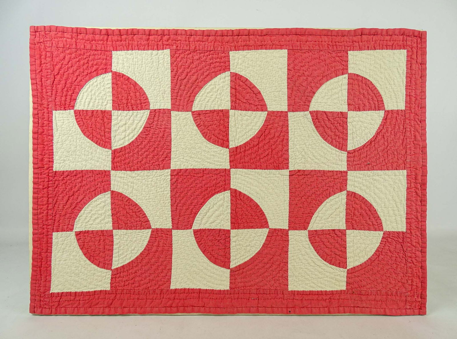 Doll's Quilt: Early geometric doll's quilt. Mounted with hanger. 16 1/4" x 22".