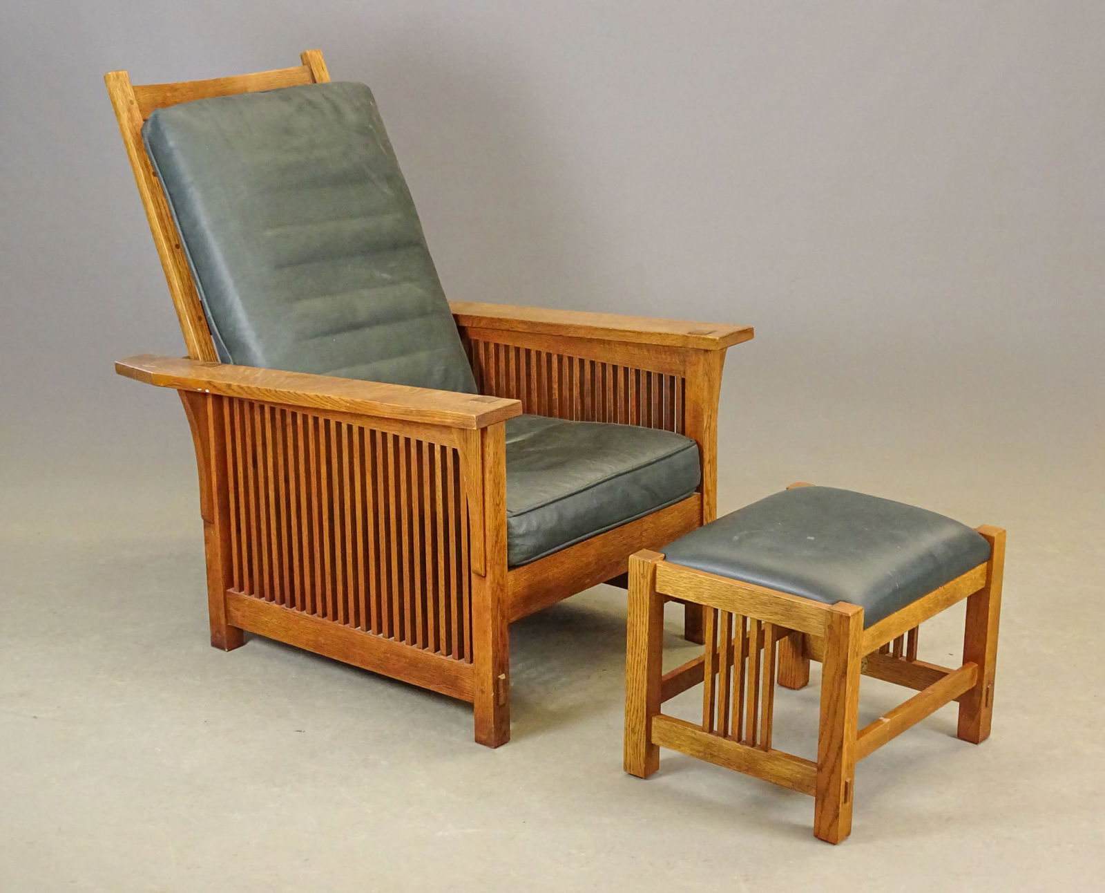 Stickley Chair and Ottoman: Mission oak style Stickley chair and ottoman. Dated 2002. 29" x 34 1/2" x 36" Ht. (adjustable back).