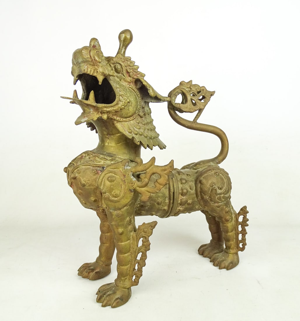 Cast Metal Dragon: Cast metal dragon sculpture. 12" W., 16 1/2" Ht..
