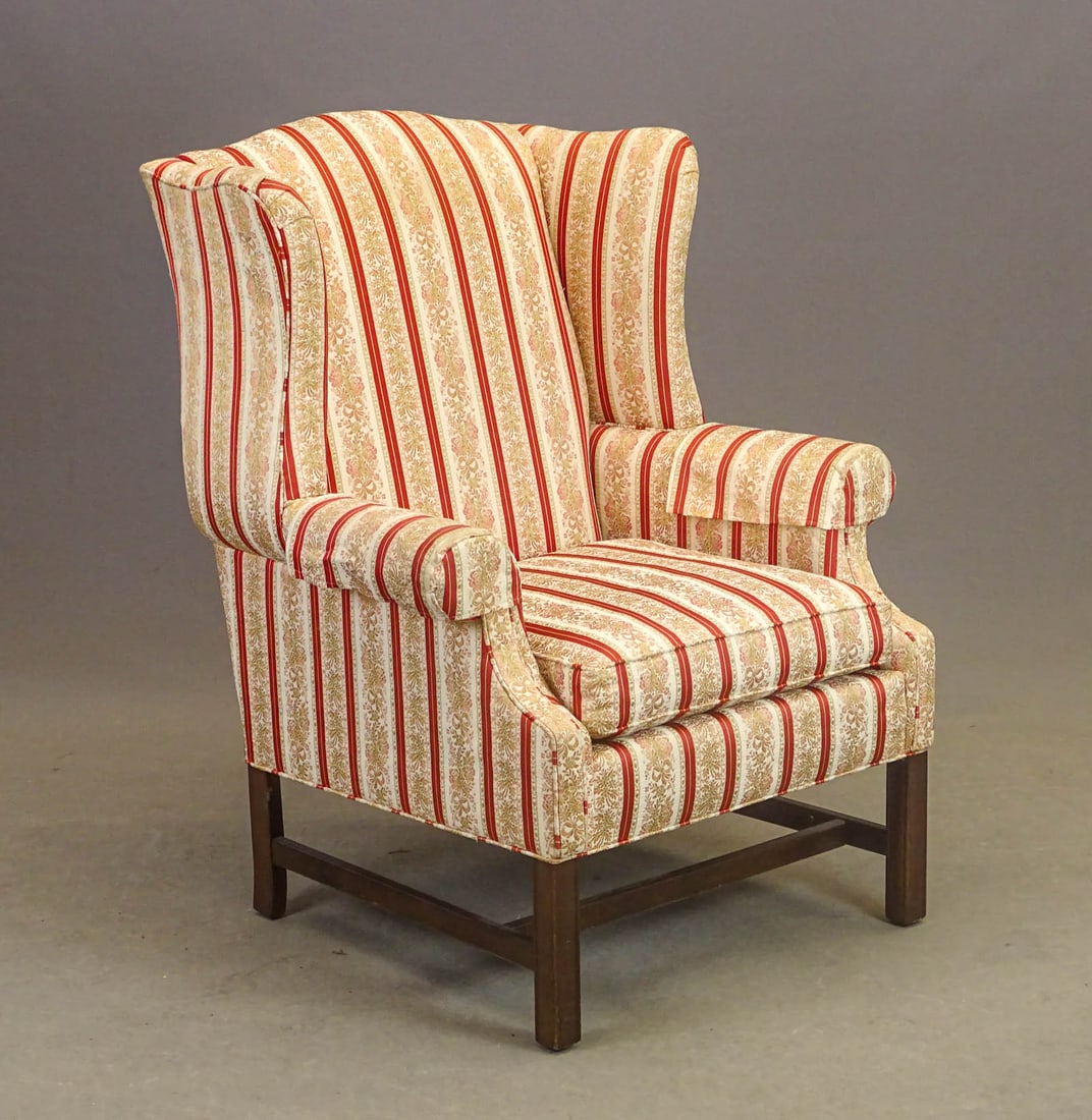 Chippendale Style Wing Chair: Chippendale style wing chair. Mahogany carved base. 19" seat Ht., 41" overall Ht..