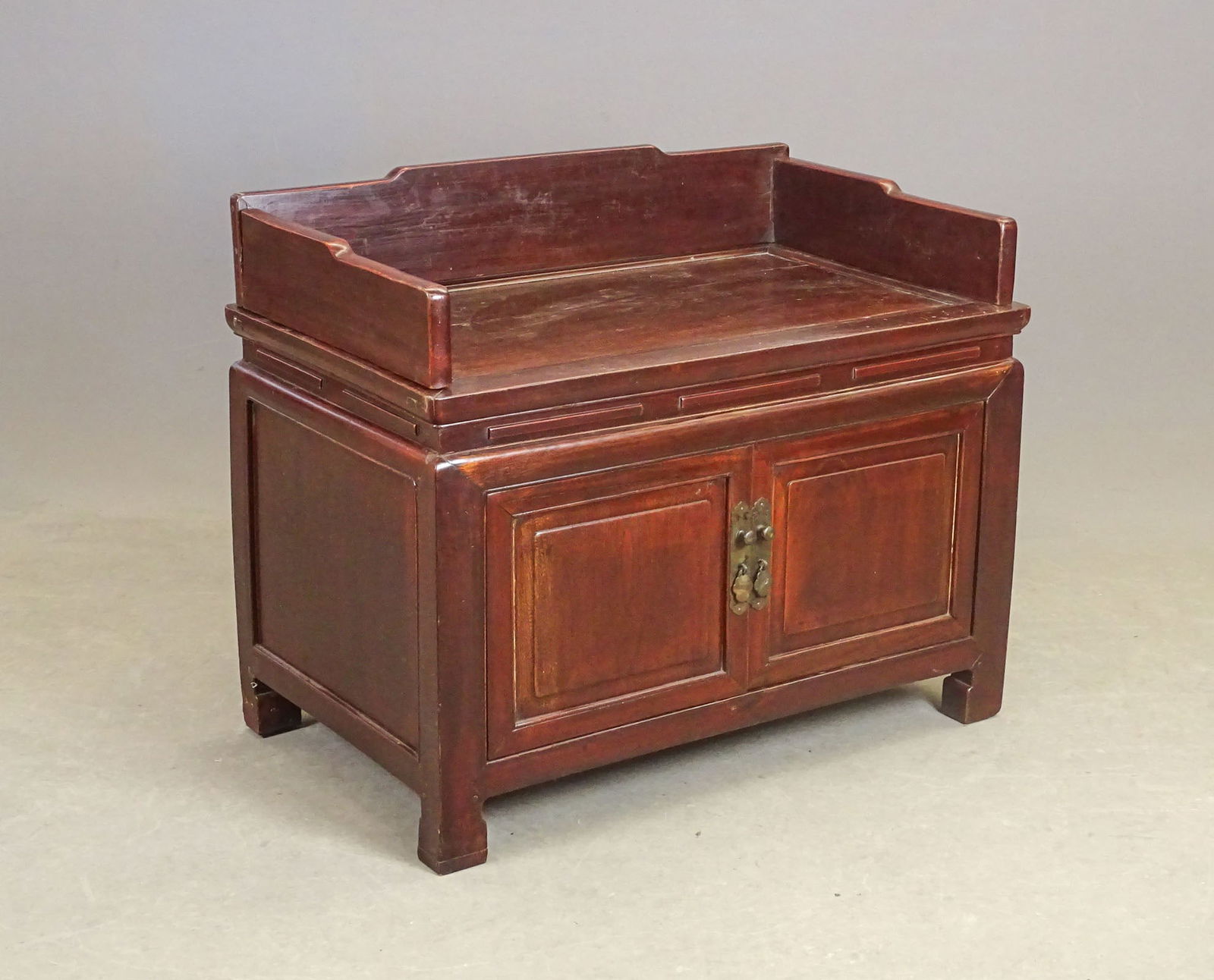 Chinese Cabinet: Chinese low hardwood cabinet with two doors and splash. 33" x 20" x 27" Ht..