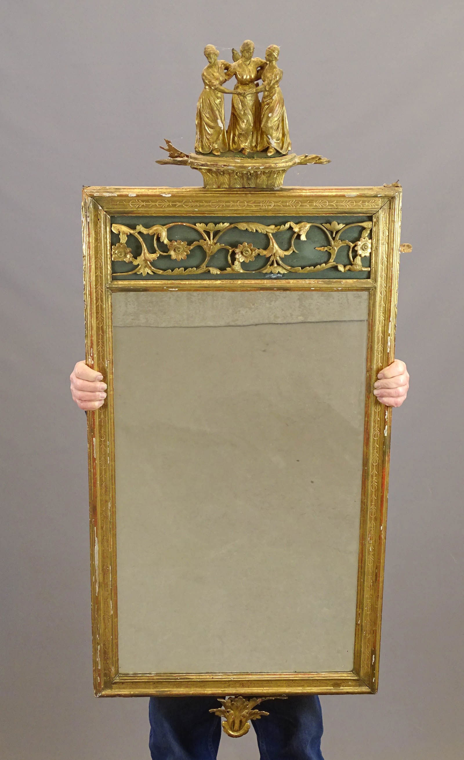 18th c. Continental Wall Mirror: 18th c. carved wooden Continental wall mirror. Top with "Three Graces". 60" x 24". Some losses.