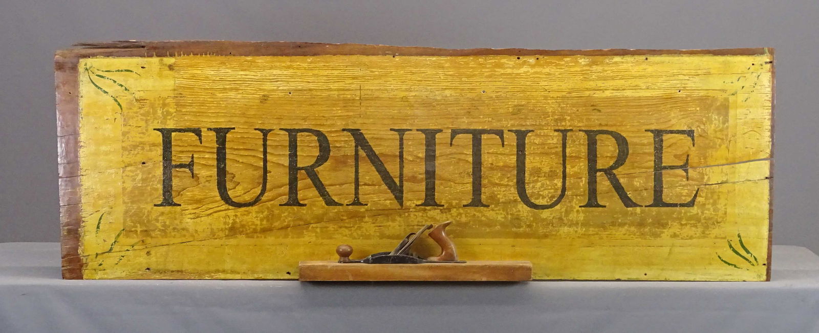 "FURNITURE" Sign: "FURNITURE" sign. Painted wood with applied plane. 25" x 75".