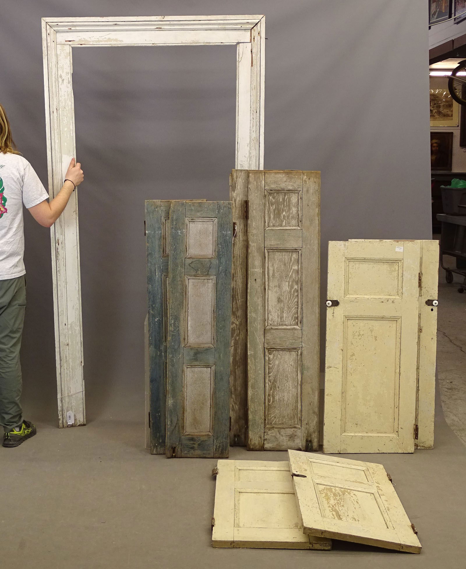 Architectural Elements: Lot of early Hudson Valley house parts including two pairs of paneled shutters in old paint, 4 cupboard doors with original hardware and door surround (7' 3" x 42" W.). Panels (2) 43" x 18", (2) 36