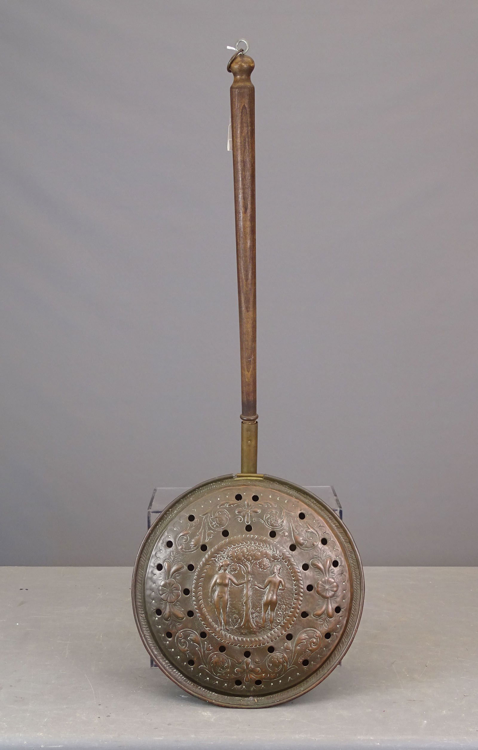 Warming Pan: Early warming pan. Lide may be 17th Century or early 18th Century. Handle and pan probably 19th Century. 37" L.. Note Adam and Eve on pan.