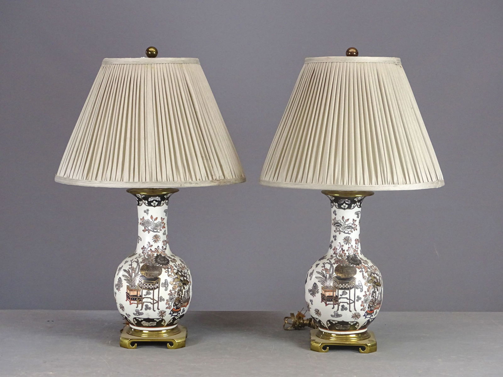 Pair of Asian Style Lamps Signed Remington: Pair of Asian style ceramic lamps signed Remington. With shades. Overall 30" Ht..