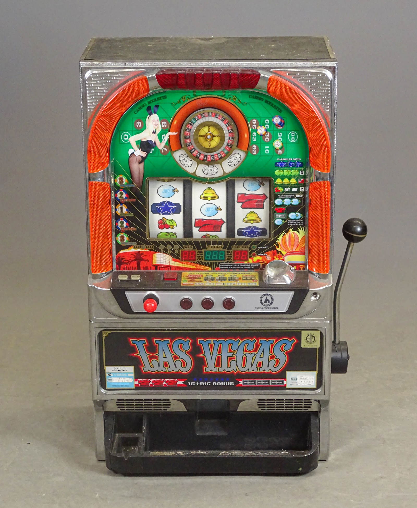 Vintage Japanes Slot Machine: Vintage Japanese slot machine. Comes with tokens. 19" x 14" x 32" Ht..