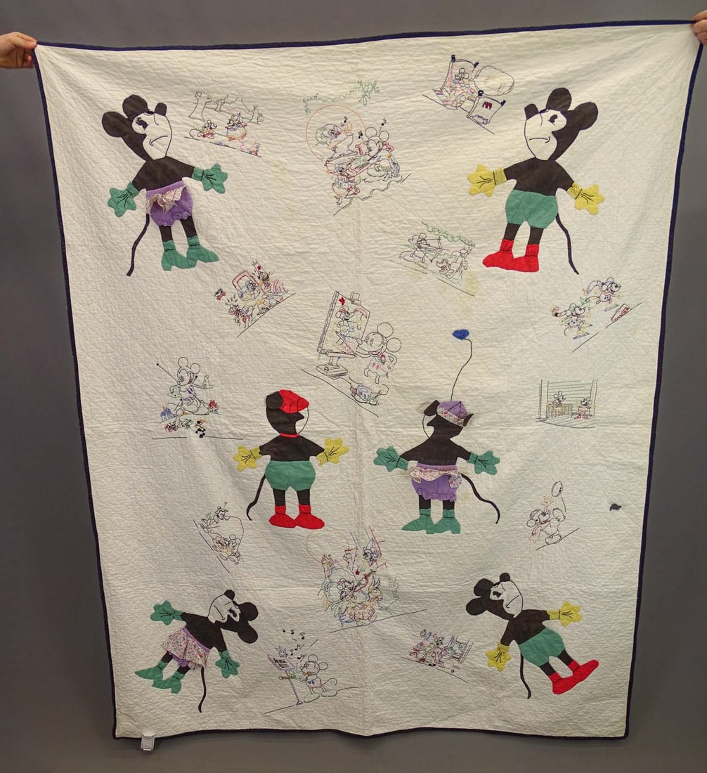 Mickey and Minnie Mouse Quilt: Rare C. 1935-45 Mickey and Minnie Mouse quilt. 65" x 80". Shelley Zegert tag. Has tear and some staining.
