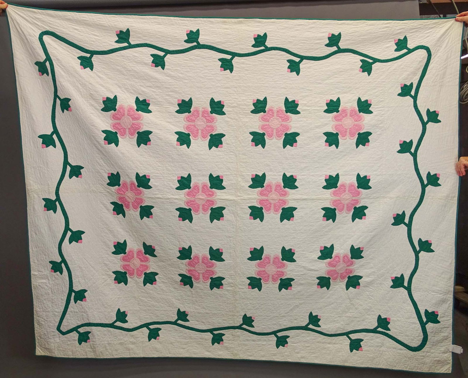 C. 1930's Floral Applique Quilt: C. 1930's pink and green floral applique quilt. 84" x 100".