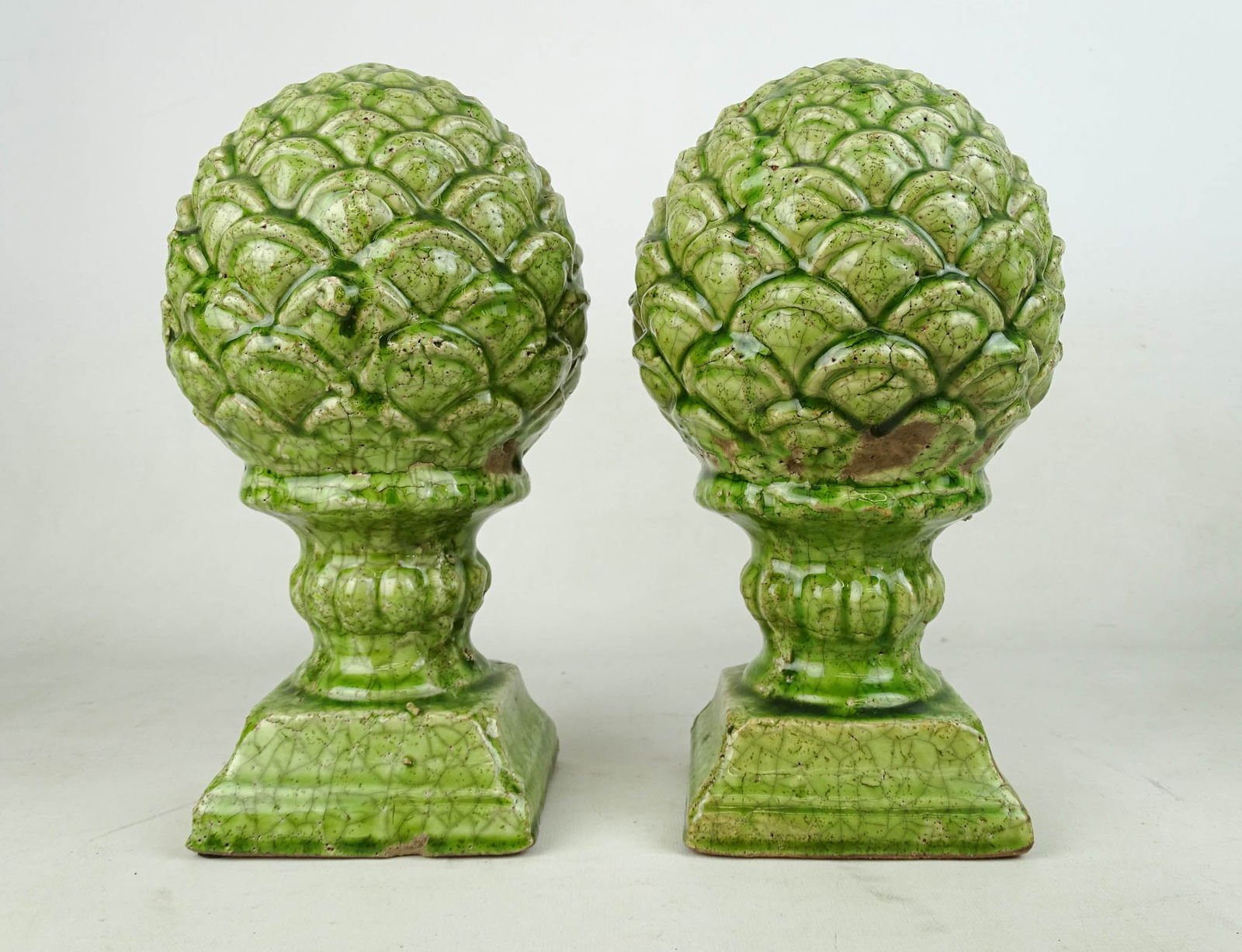 Pair Ceramic Finials: Pair of ceramic green glaze finials. 11" Ht.. Small chip at base.
