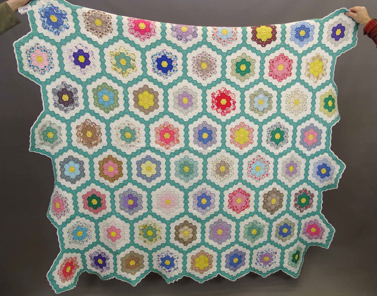 C. 1940's Grannies Garden Quilt: C. 1940's Grannies Garden quilt. 66" x 68".